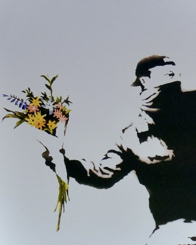 Detailed view of the bouquet of flowers in Banksy's 'Love Is In The Air' print, emphasizing the vibrant colors against the monochrome background.