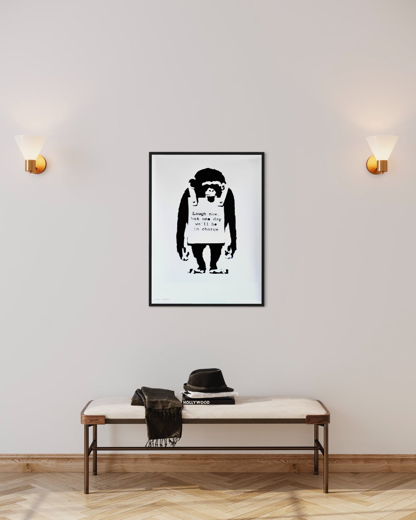 Framed 'Laugh Now' print by Banksy displayed on a wall, adding a striking focal point to the room.