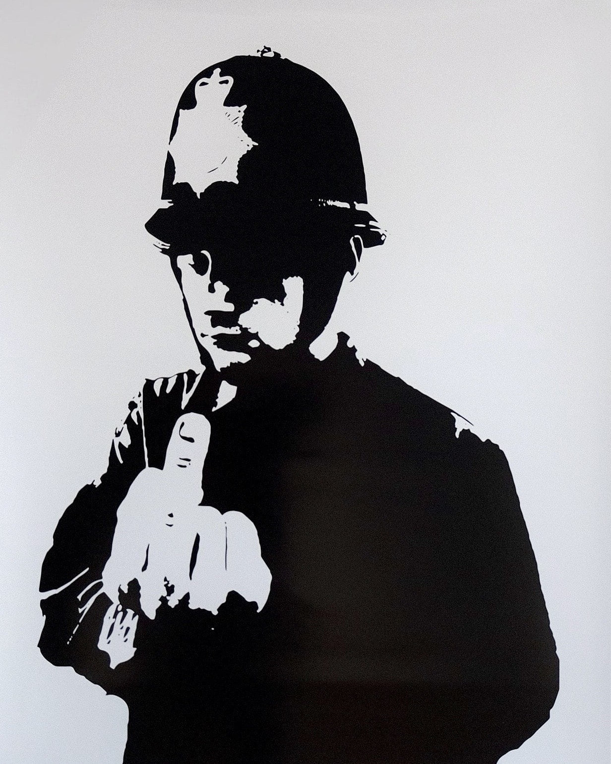 Iconic 'Rude Copper' print by Banksy, highlighting the critique of police corruption with a provocative gesture.