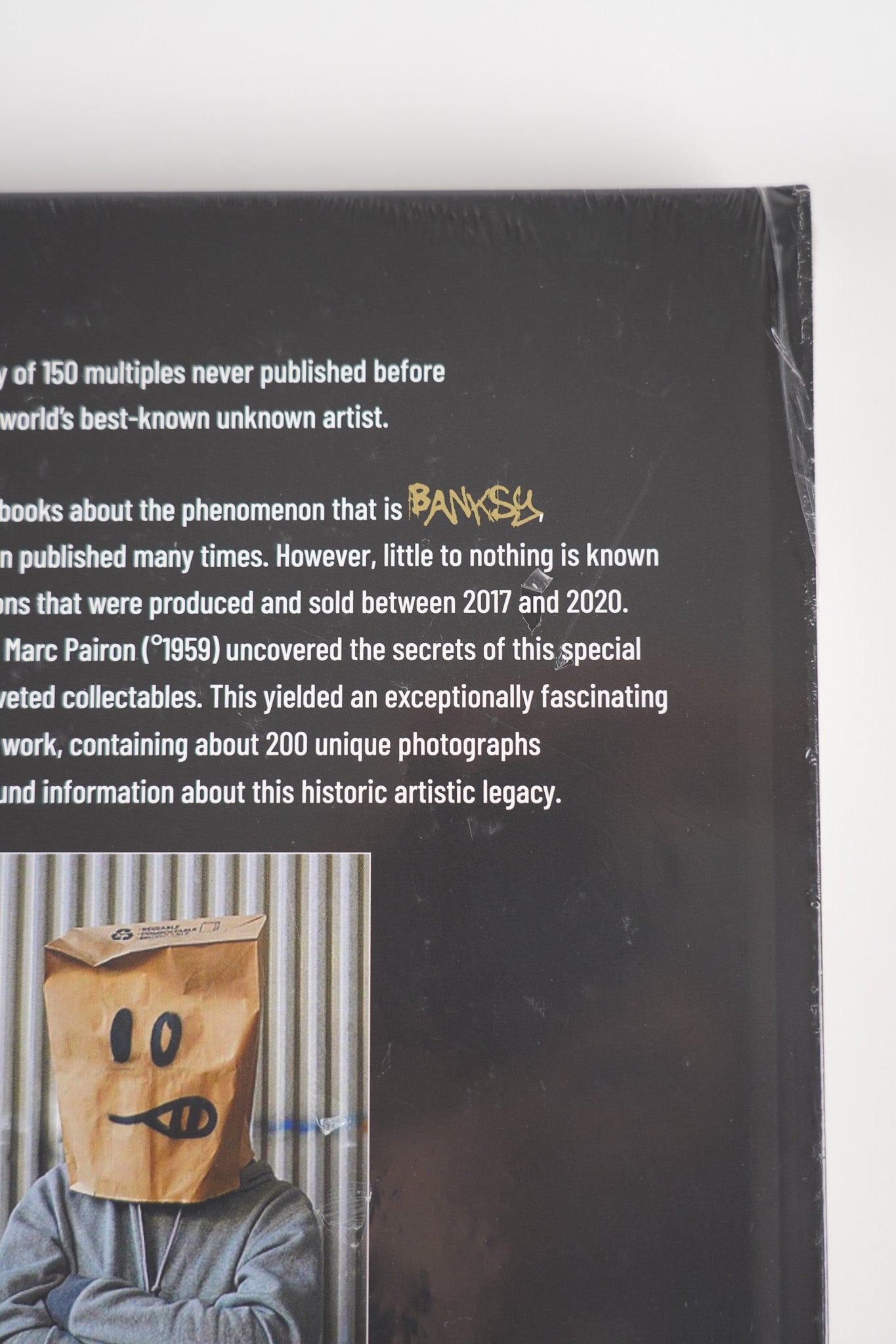 Close-up of the artwork design on the back cover of "Banksy: The Walled Off Art Editions Are Sold Out".