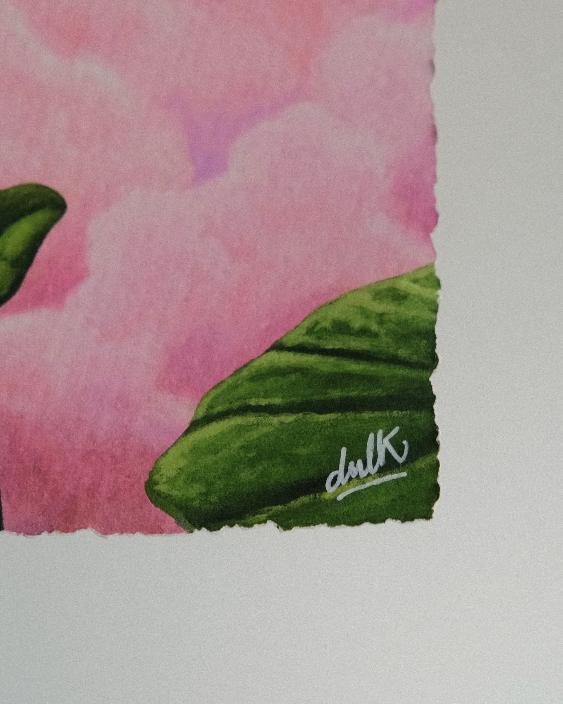 Close-up look at the print “Luna” Dulk where a signature of the artist is visible.