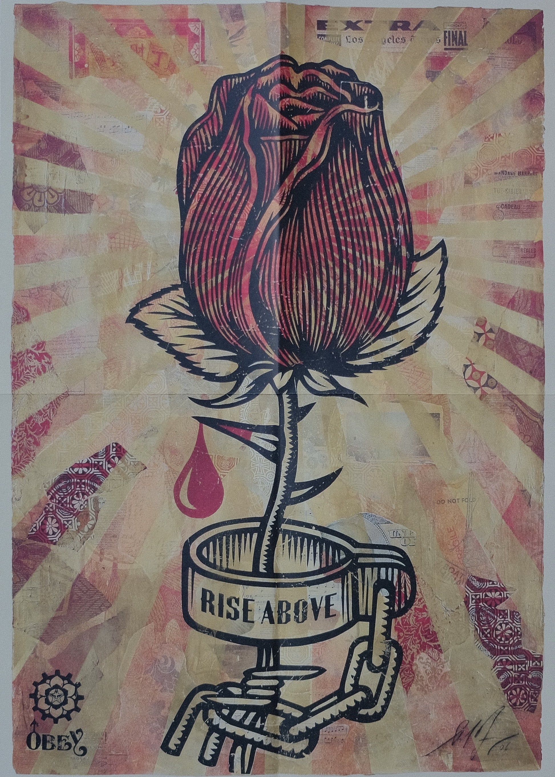 Full view of the 'Rise Above' print by Shepard Fairey which comes together with the book "Supply & Demand". The print is mainly in red colours with a huge red rose in the middle. There is a red drop dripping from a thorn of the rose. There is a chain around the rose where written Rise Above.