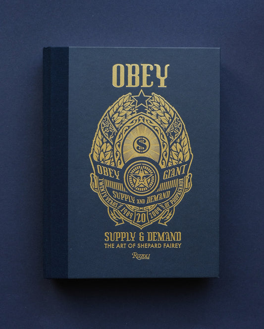 "Cover of 'Obey: Supply & Demand - The 20 Year Edition' signed by Shepard Fairey."