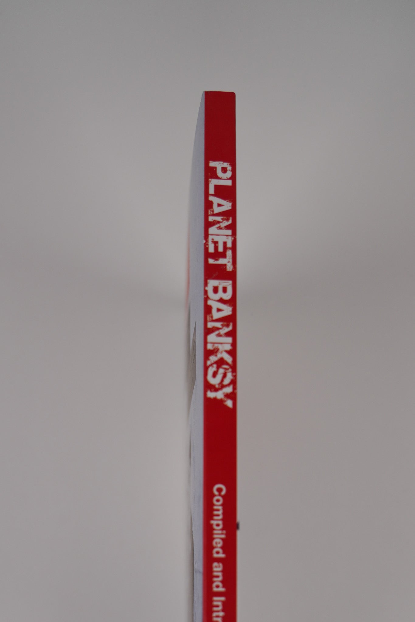 Spine of "Planet Banksy," displaying the book title.