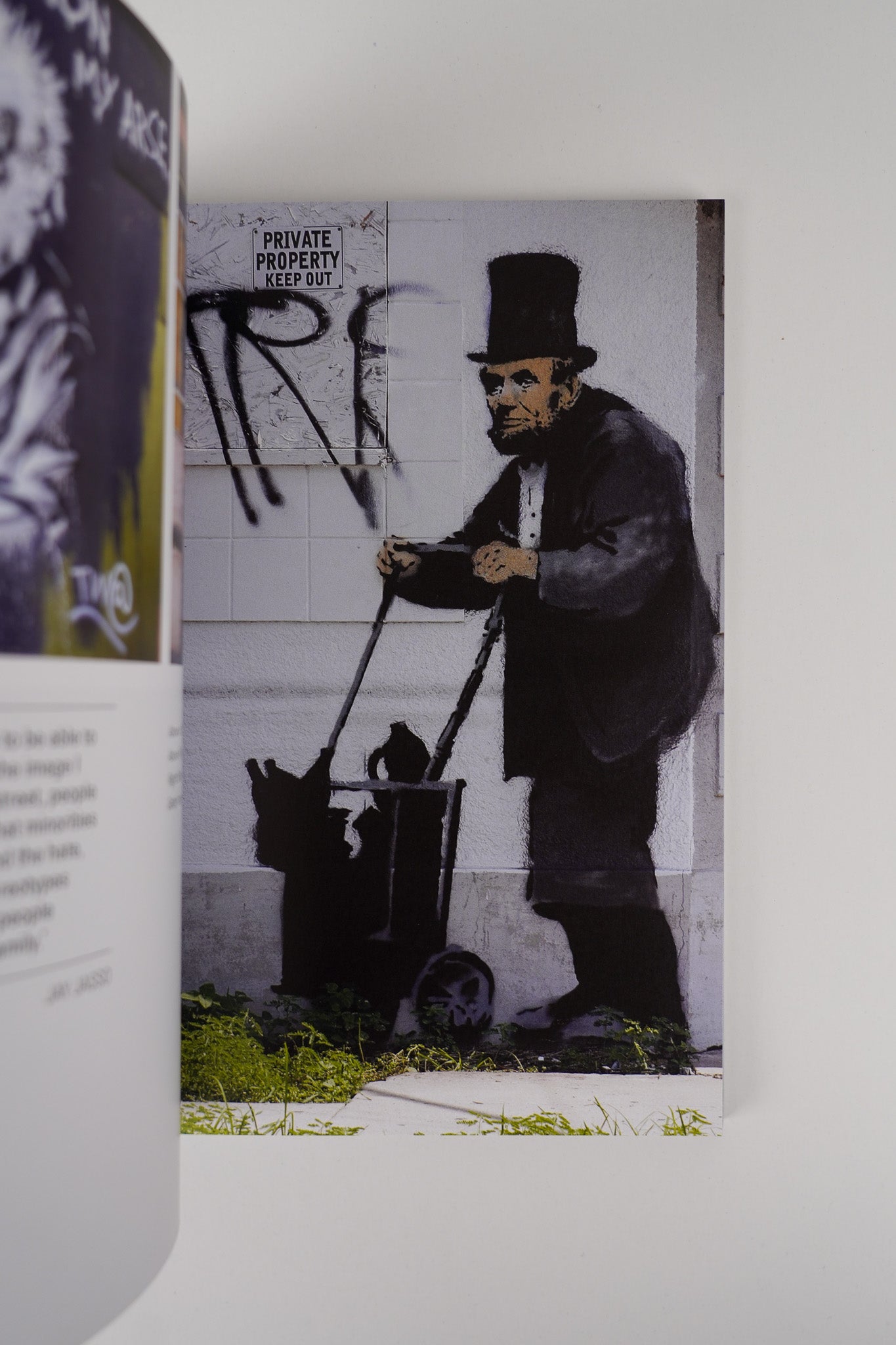 Open pages "Planet Banksy," featuring curated images of urban art and its social messages.